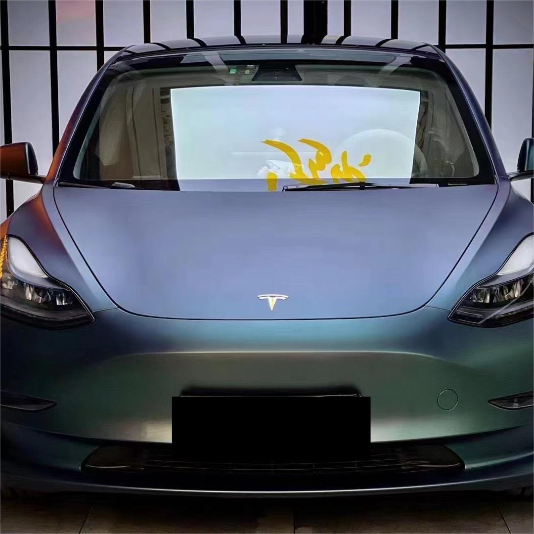 Aerodynamic fender curves capturing a light-bending, bubble-free installation of ALUKOCARWRAP diamond green car wrap with active matte green car wrap physics.