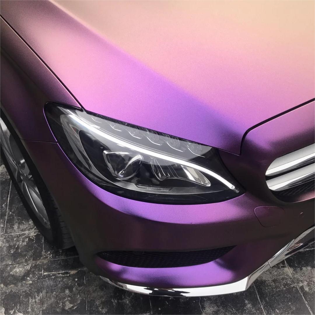 Complex car body contours capturing a glare-free, paint-like layout of ALUKOCARWRAP matte metallic car wrap matrix with zero reflections.