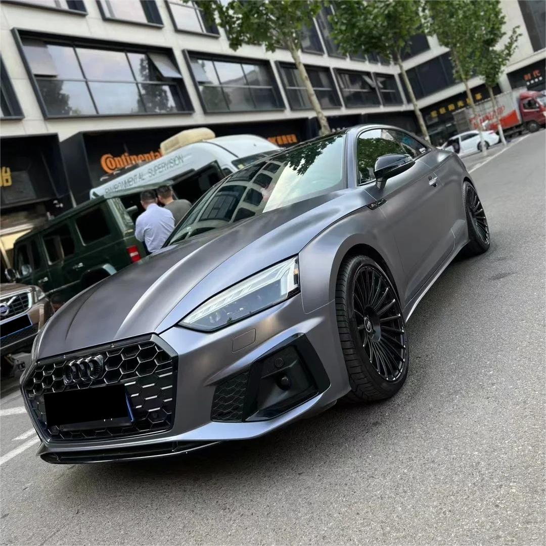 Aero-grade stealth aesthetic on a supercar clad in ALUKOCARWRAP matte grey car wrap, defining a premium metallic grey car wrap contour.