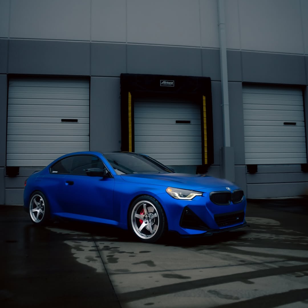 A high-performance electric coupe wrapped in Matte Metallic Satin Blueberry Car Vinyl Wrap PET, showing rich frosty berry tones.
