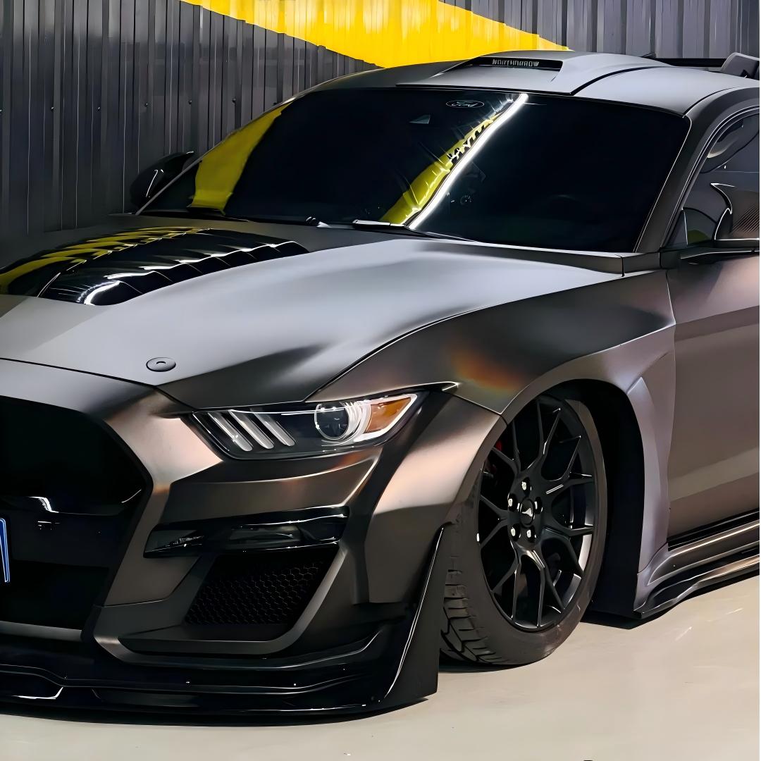 Close-up of matte chrome car wrap by ALUKOCARWRAP, accentuating sharp body lines with a frosted rainbow laser spectrum