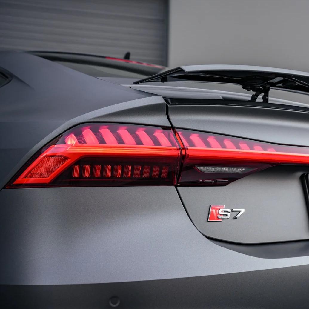 Close-up details of premium Satin Chrome X Silver Car Wrap on a modern EV panel, displaying a smooth matte finish.