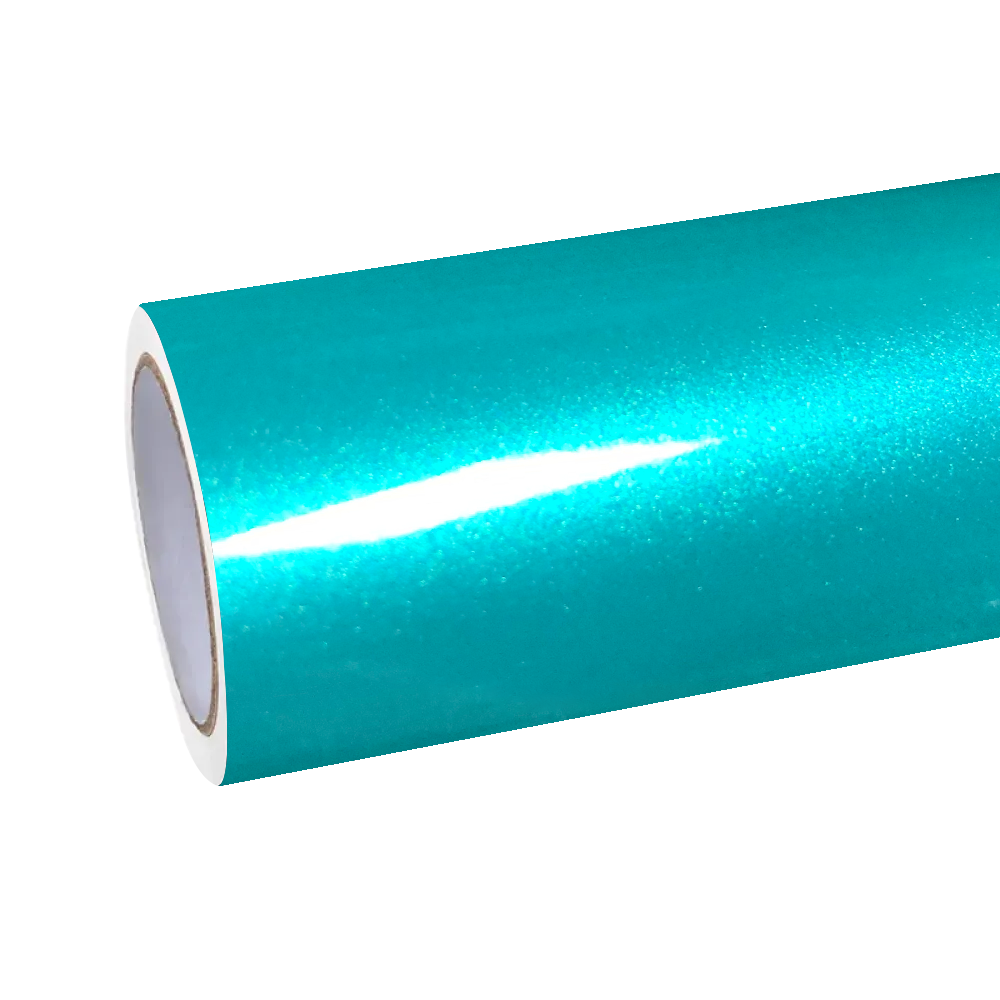 A pristine uninstalled spool of ALUKOCARWRAP Ocean Blue Car Wrap resting in a professional detailing studio, showcasing the raw reflective gloss of the vinyl roll before custom application.