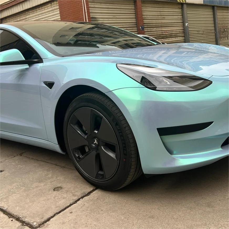 Micro-fleck detailing of a Candy Blue Car Wrap film surface, emphasizing the glass-like transparency of the protective gloss clearcoat.