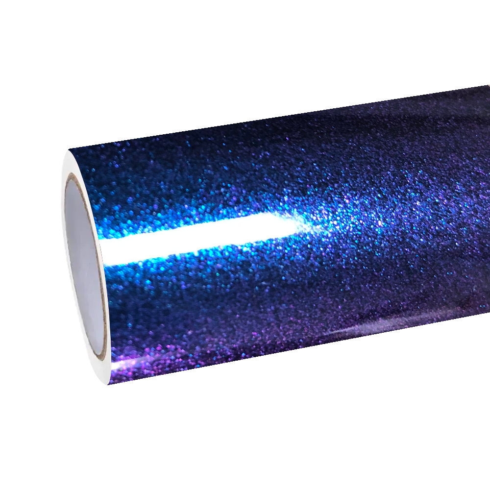 ALUKOCARWRAP metallic diamond car wrap on a supercar reflecting glowing city neon lights, showcasing premium gloss metallic car wrap reflectivity.