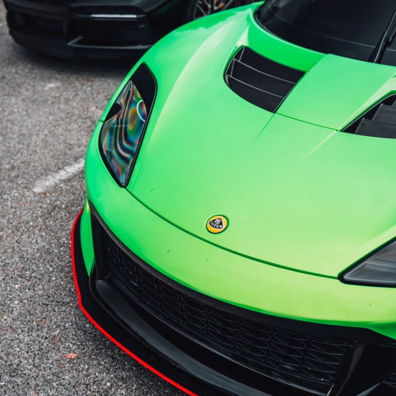 Luxury sports car wrapped in gloss metallic gold green vinyl wrap PET, featuring a flawless reflection mirror finish.