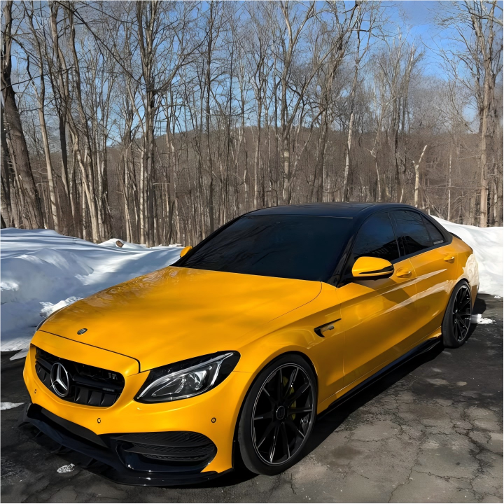 ALUKOCARWRAP Gloss Metallic Golden Yellow Car Vinyl Wrap PET on a hypercar, projecting luxurious 24K liquid gold reflections.