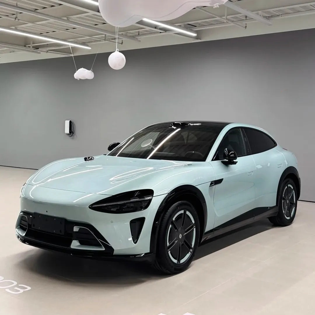 Sleek sports car in ALIKOCARWRAP Gloss Metallic Shadow Celadon Green Car Vinyl Wrap PET, showing dynamic light shifts.