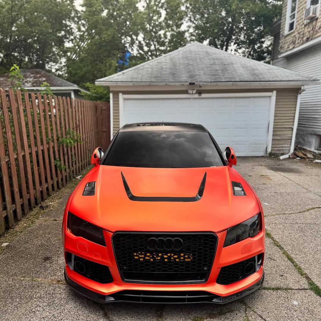 Passenger door close-up featuring ALUKOCARWRAP Ultimate Flat Matte Metallic Stunning Orange Car Vinyl Wrap PET under midday sun