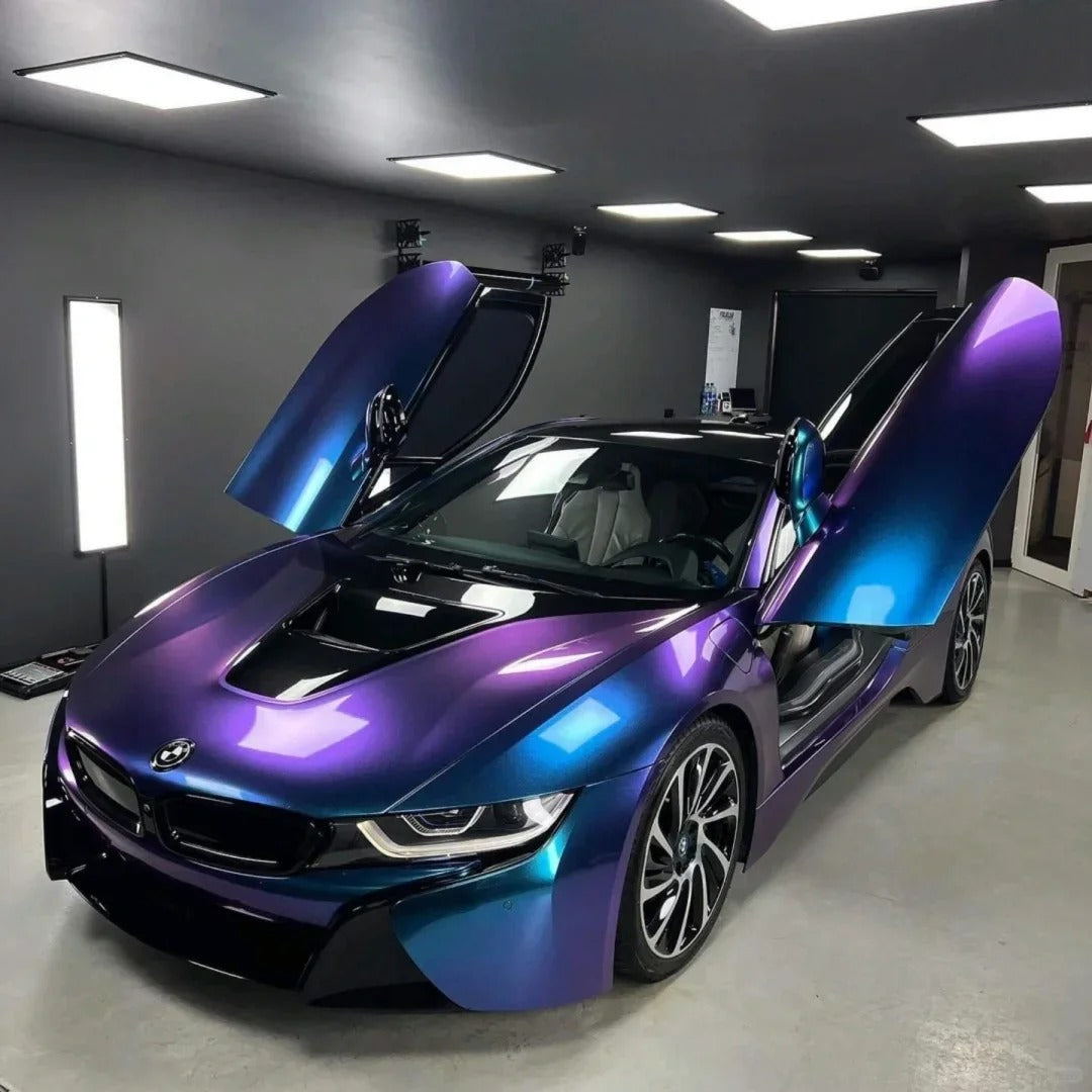 Deep metallic purple car wrap hue looking dark and mysterious under overcast skies, highlighting the premium finish of this purple red car wrap.