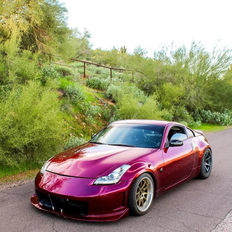 Luxury cabriolet wrapped in Aluko gloss metallic rubellite purple car vinyl wrap PET, showcasing a rich ruby-to-amethyst shift.