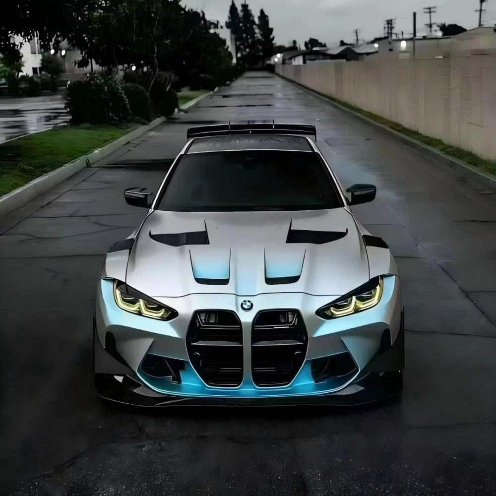 Luxury sports sedan featured in metallic silver vinyl wrap, showcasing the sleek matte chameleon silver blue finish.
