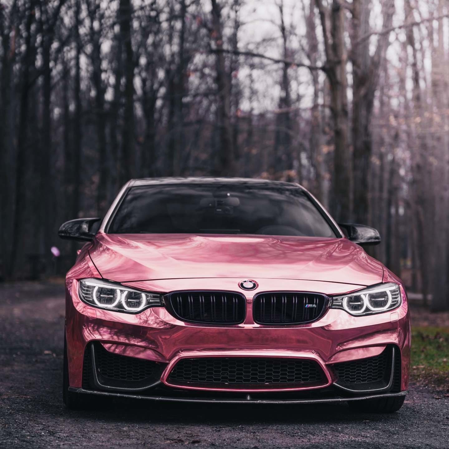 An exotic supercar showcasing a high-reflection Gloss Mirror Chrome Rose Gold Car Vinyl Wrap under clear bright sunlight.