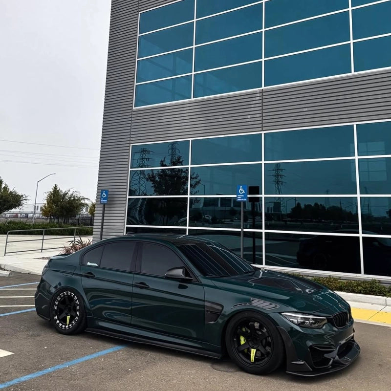 Luxury car wrapped in Aluko gloss Mohsen Green car vinyl wrap PET, showcasing a deep liquid green zero orange peel mirror finish.