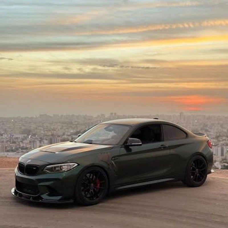 Luxury vehicle wrapped in Aluko glossy paint metallic Midnight Green car vinyl wrap PET, showing an OEM paint-like mirror finish.