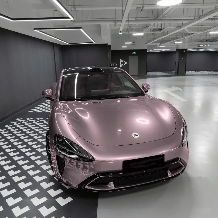 Close-up of ALIKOCARWRAP gloss pink car wrap PET on body curves, proving a flawless paint-like zero distortion finish.