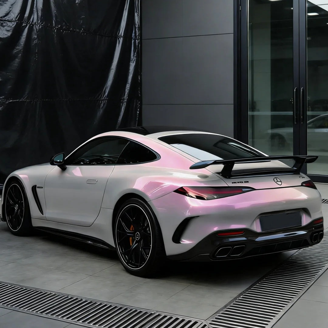 Detail view of chameleon pink grey color PPF by ALUKOCARWRAP showing metallic flakes and high gloss shine.
