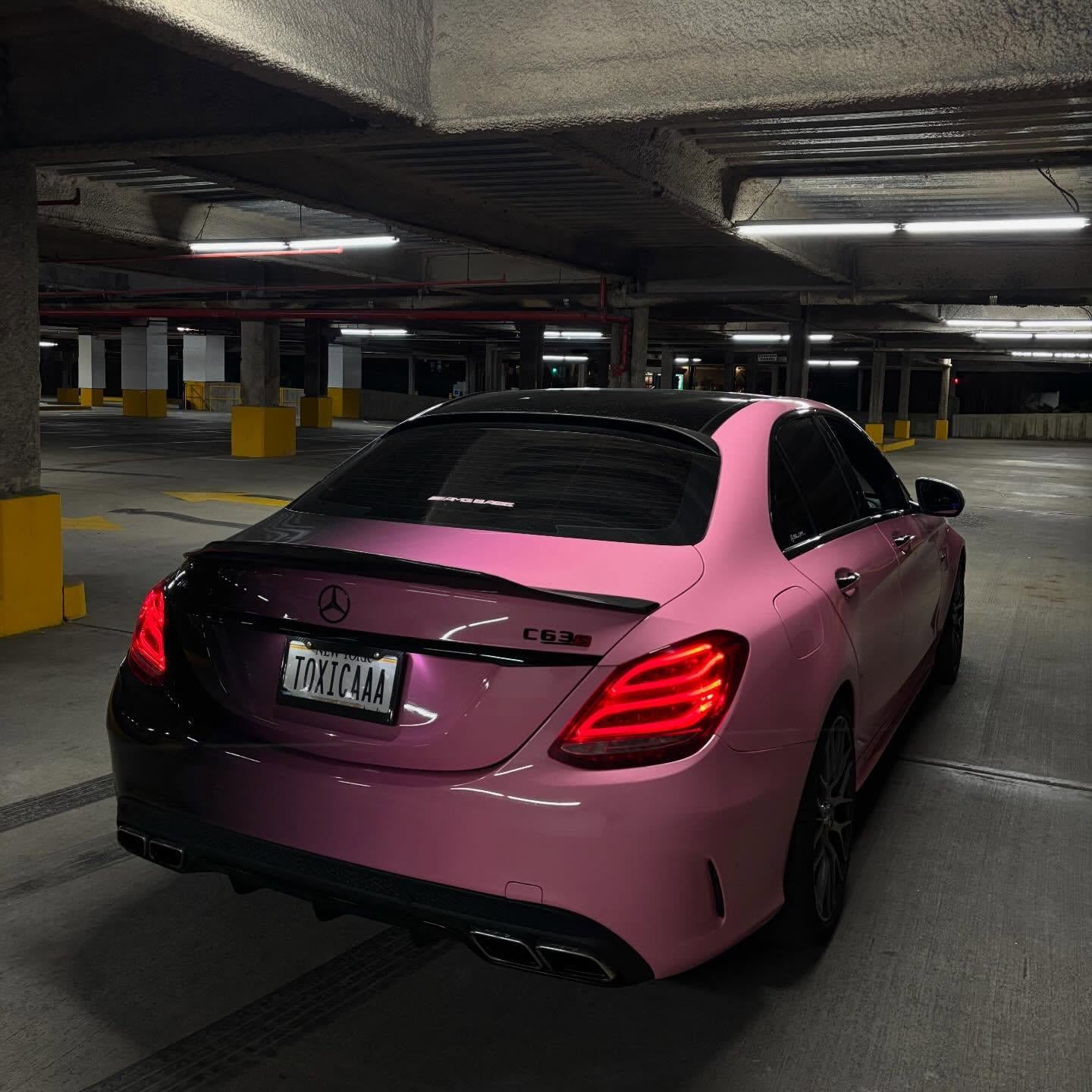 Full vehicle wrap with ALUKOVINYL pink to black gradient custom printed vinyl wrap on a sports car.