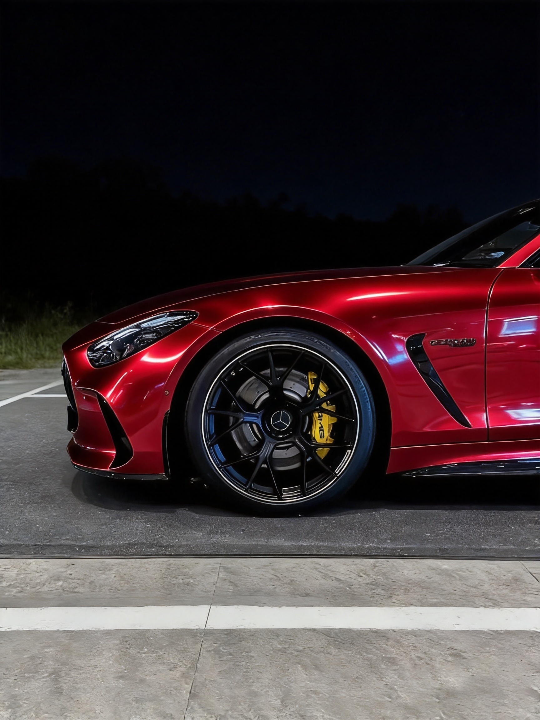 Close-up detail of the Gloss Red Holographic Chrome wrap on an automotive fender, showing the mirror chrome reflection.