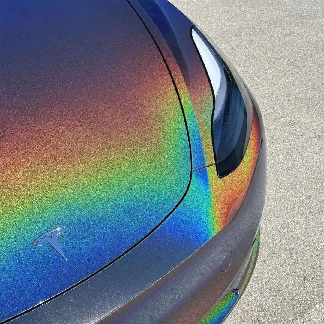 Micro shot of aggressive metallic flakes on a gloss metallic car wrap by ALUKOCARWRAP, highlighting rainbow laser laser flip details on a sharp body line.