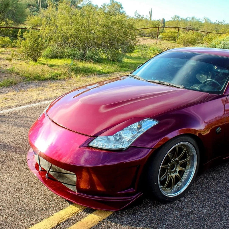 Close viewpoint of rubellite purple gloss metallic car vinyl wrap PET on luxury car body, capturing the liquid crystal gloss.