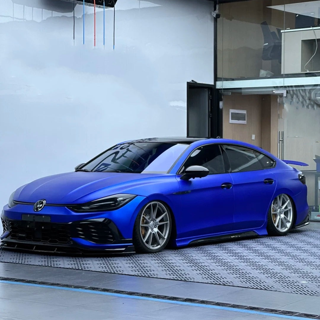 Complete car makeover using a commanding Dark Blue Car Wrap finish, showcasing a sleek and modern automotive aesthetic from a front-three-quarter view.