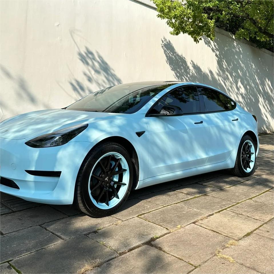 A crisp, ice-carved look on a luxury sports sedan enveloped in ALUKOCARWRAP satin blue car wrap, emphasizing flat matte blue car wrap aerodynamics.