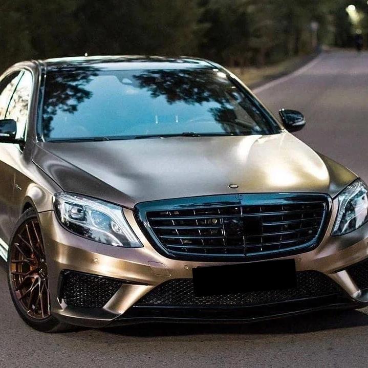 A luxury vintage sports car draped in Satin Chrome Gold Brown Car Vinyl Wrap, showcasing high-end semi-gloss metallic curves.