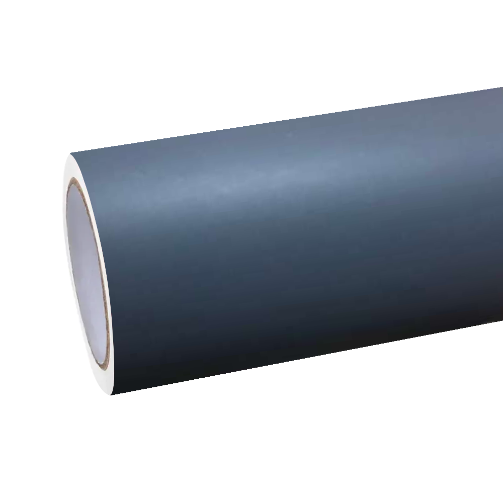 Harsh industrial spotlights completely diffused across the poured-concrete texture of ALUKOCARWRAP cement grey car wrap film with a silk-satin sheet.