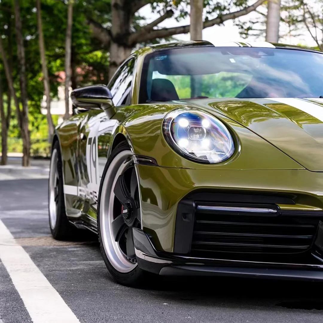 Close-up of high gloss military green paint protection film by ALUKOCARWRAP showing mirror finish.