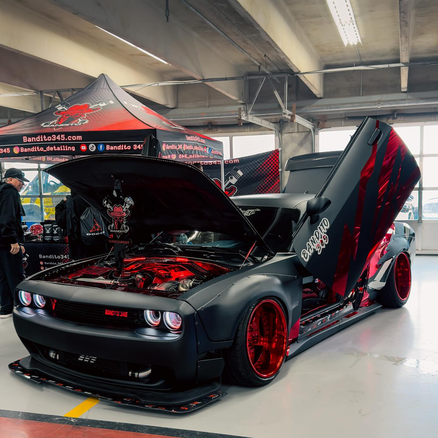ALUKOCARWRAP Matte Ultimate Flat Deep Black Car Vinyl Wrap on a sports car, showing a light-absorbing stealth finish.