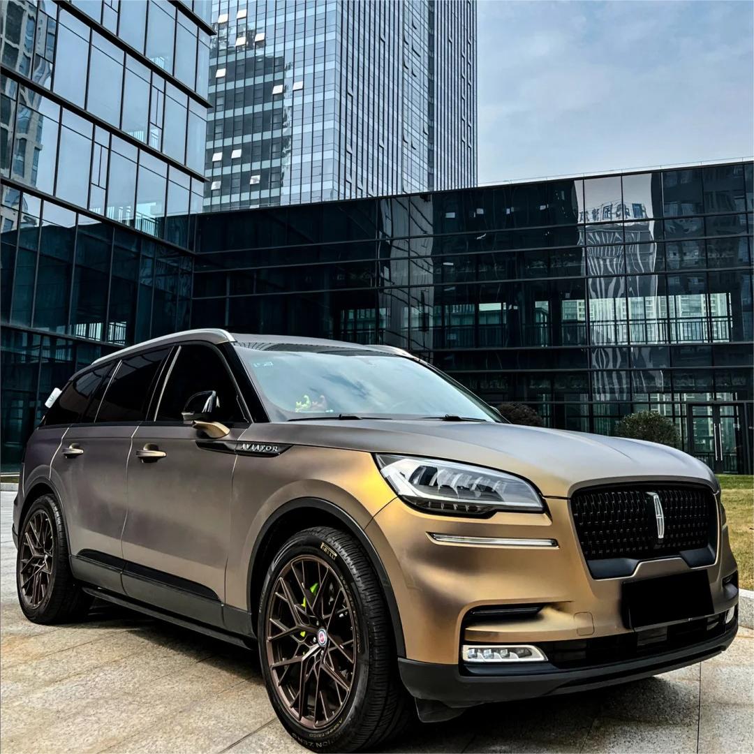 A menacing, stealth-wealth profile on a hypercar enveloped in ALUKOCARWRAP ultra matte car wrap, flashing a hidden constellation of black gold car wrap flakes under direct beams.