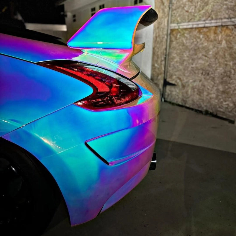Close-up of gloss holographic chrome white car vinyl wrap PET, premium mirror finish and seamless edge wrap by ALUKOCARWRAP.