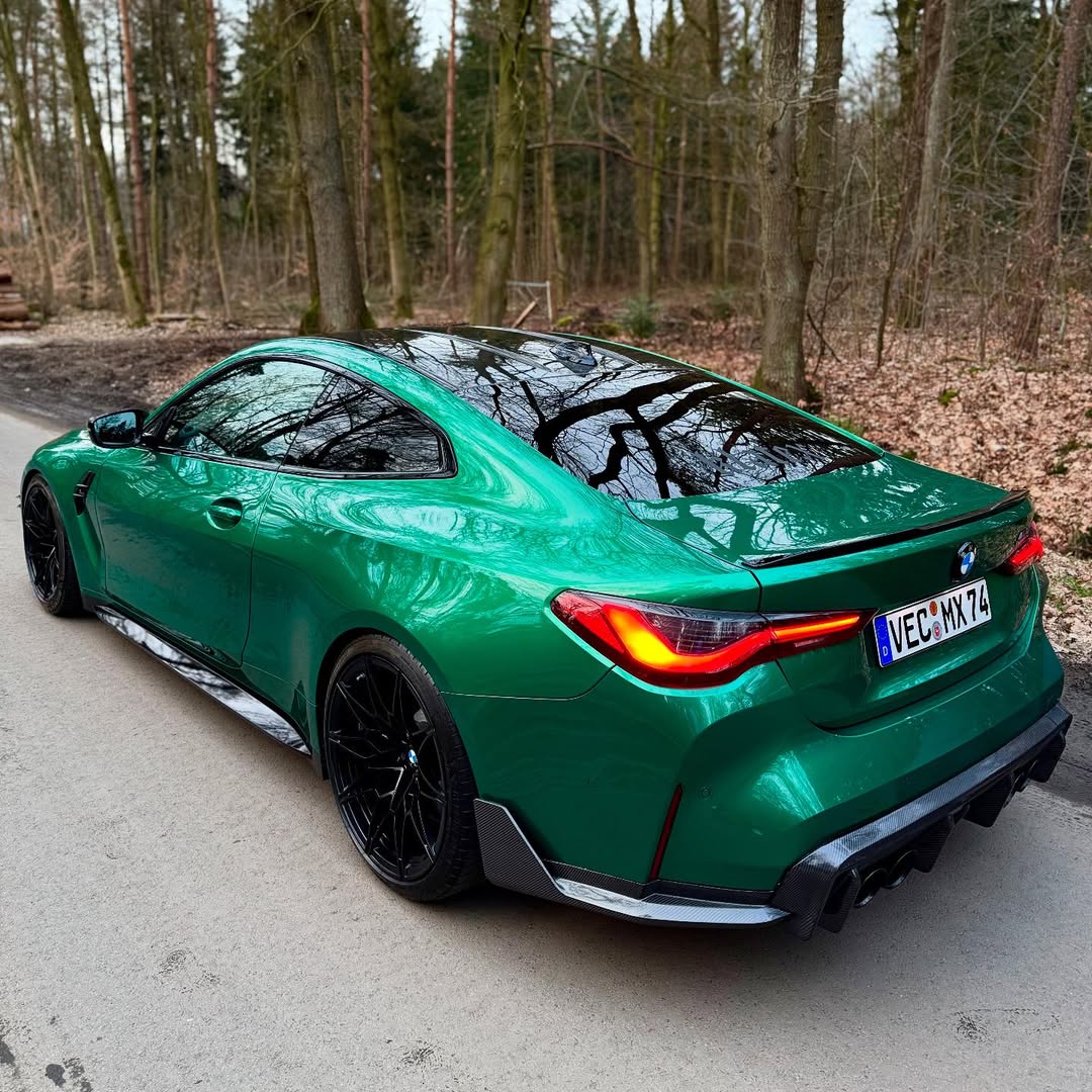 Vibrant gold-emerald reflections on the sleek lines of Gloss Metallic Isle Of Man Green Car Vinyl Wrap.