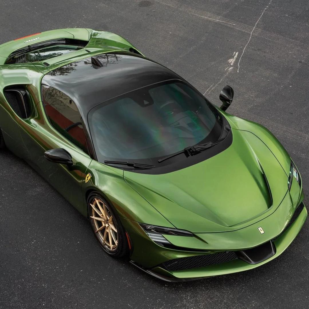 Car finished in Mamba Green metallic vinyl wrap with glossy reflections across the body