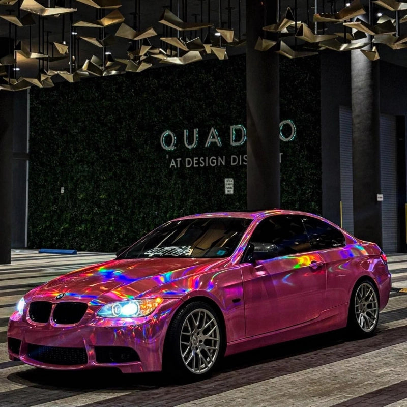 German sports coupe upgraded with pink holographic chrome laser car vinyl wrap, high-end neo-chrome vehicle styling in Australia.