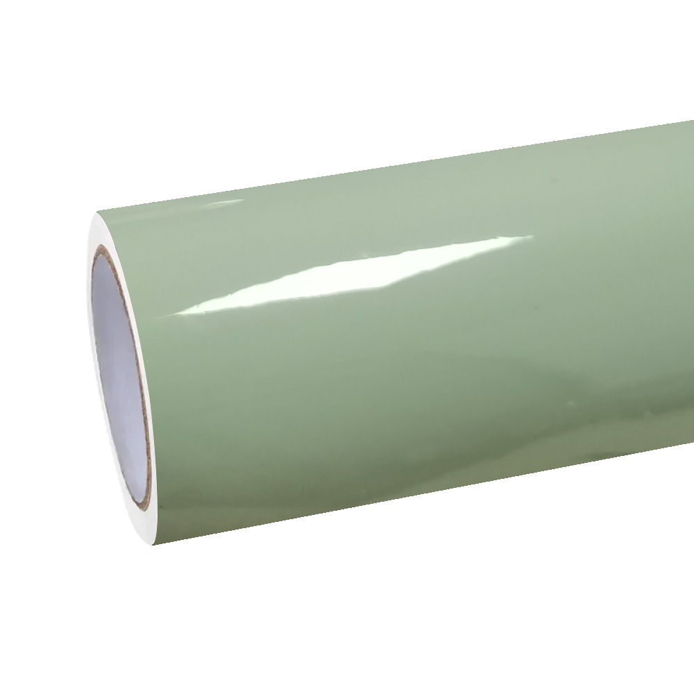 A roll of ALUKOCARWRAP gloss light khaki green car vinyl wrap film unrolled on a workbench, ready for a professional custom car wrapping project.