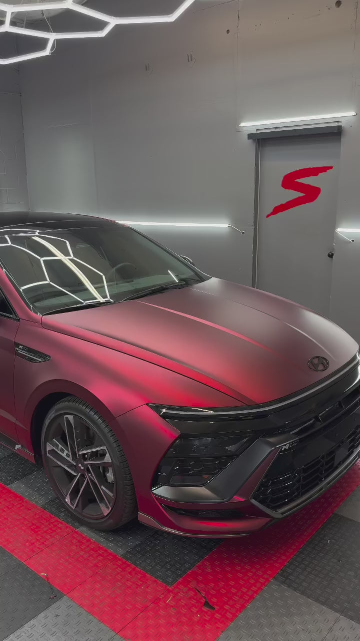 Close-up of Magic Flame Ruby Red PPF by ALUKOCARWRAP, delivering a premium matte paint protection film exotic look.