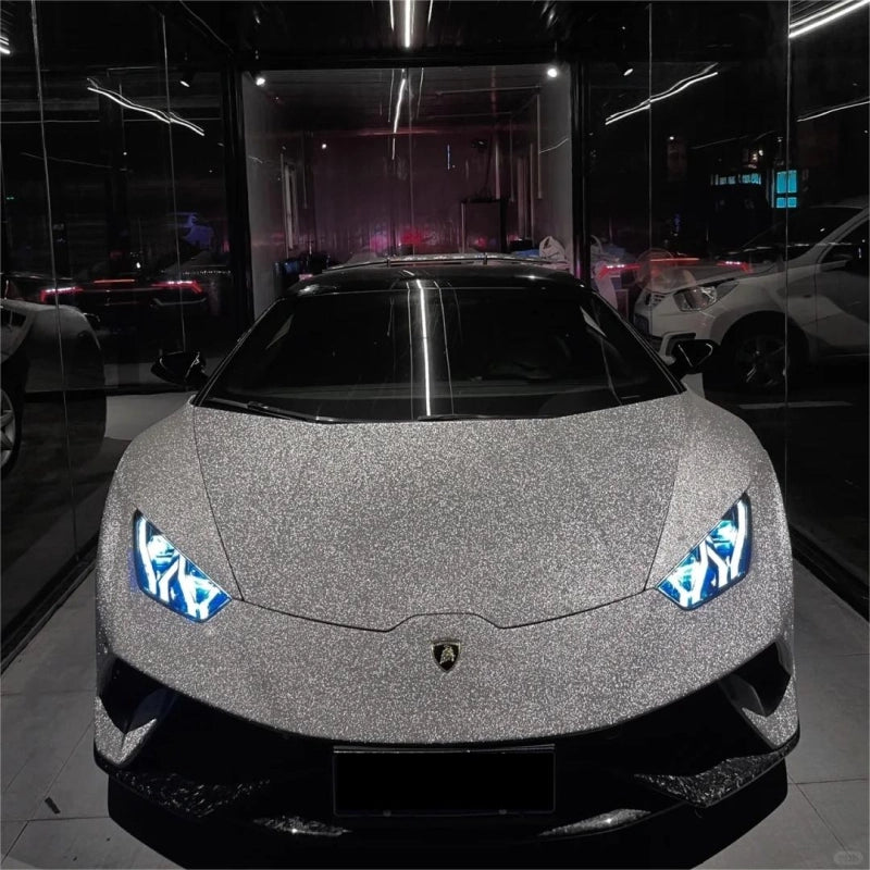 Sleek side angle of silver matte diamond glitter car vinyl wrap finish, capturing the premium satin frosted metallic film texture.